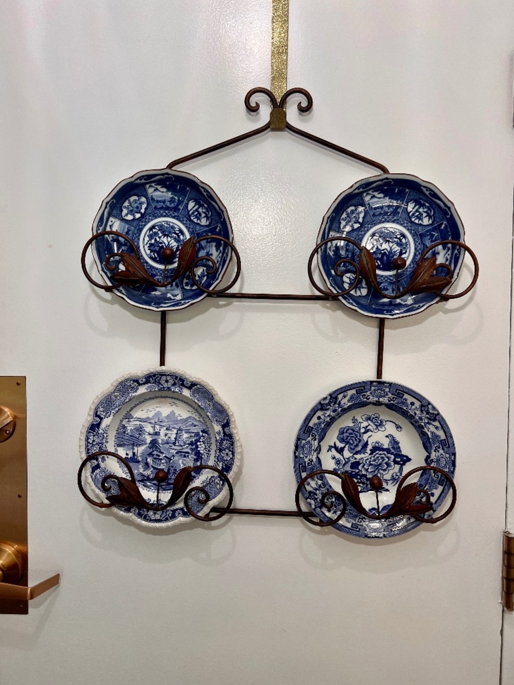 Vintage two-tier dark bronze metal wall-mounted plate or platter display rack